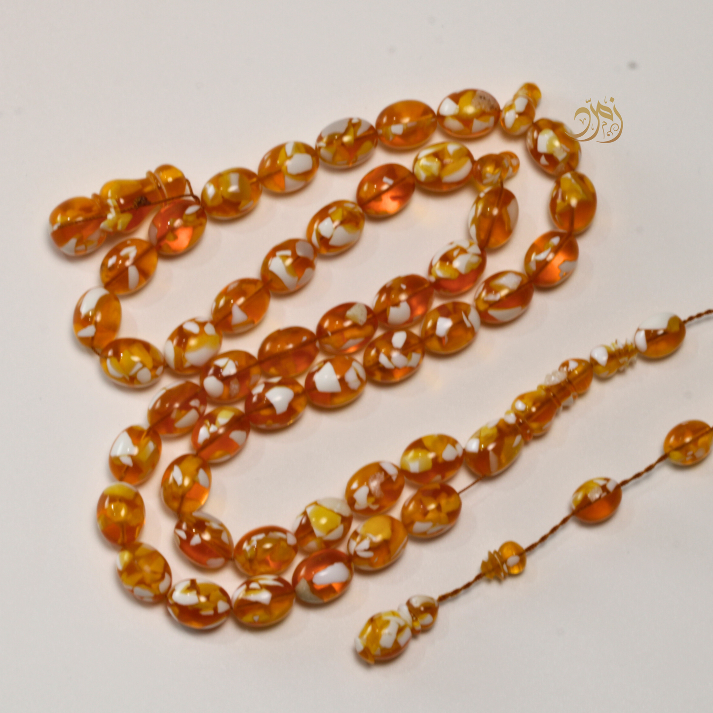 سبحة مستكة (قشطة وعسل ) غامق 45 خرزة بيض حمام (شاهد +كبوس) سبير