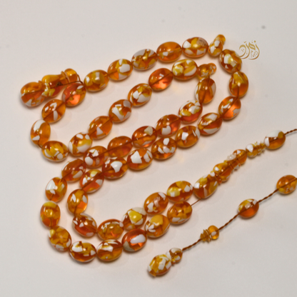 سبحة مستكة (قشطة وعسل ) غامق 45 خرزة بيض حمام (شاهد +كبوس) سبير