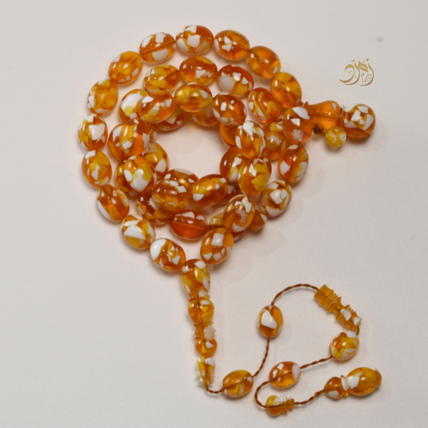 سبحة مستكة (قشطة وعسل ) غامق 45 خرزة بيض حمام (شاهد +كبوس) سبير