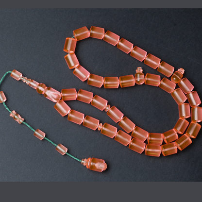 سبحة كاست لون مشمشي شفاف - دائري او برميلي