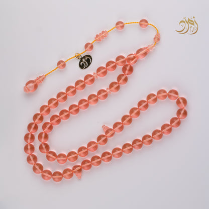 سبحة كاست لون مشمشي شفاف - دائري او برميلي