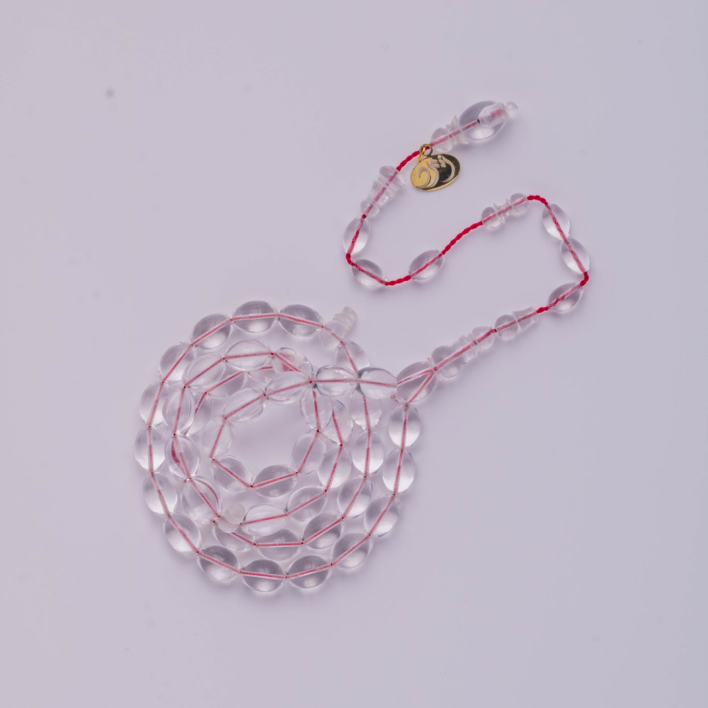 سبحة كاست شفاف خيط احمر  47 خرزة زيتوني