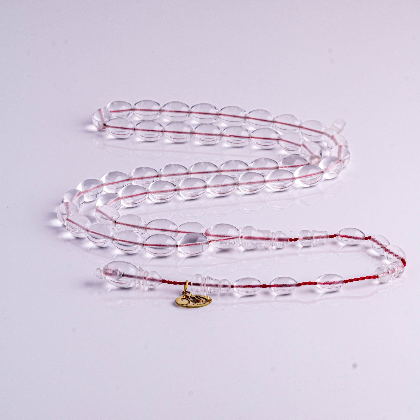 سبحة كاست شفاف خيط احمر  47 خرزة زيتوني